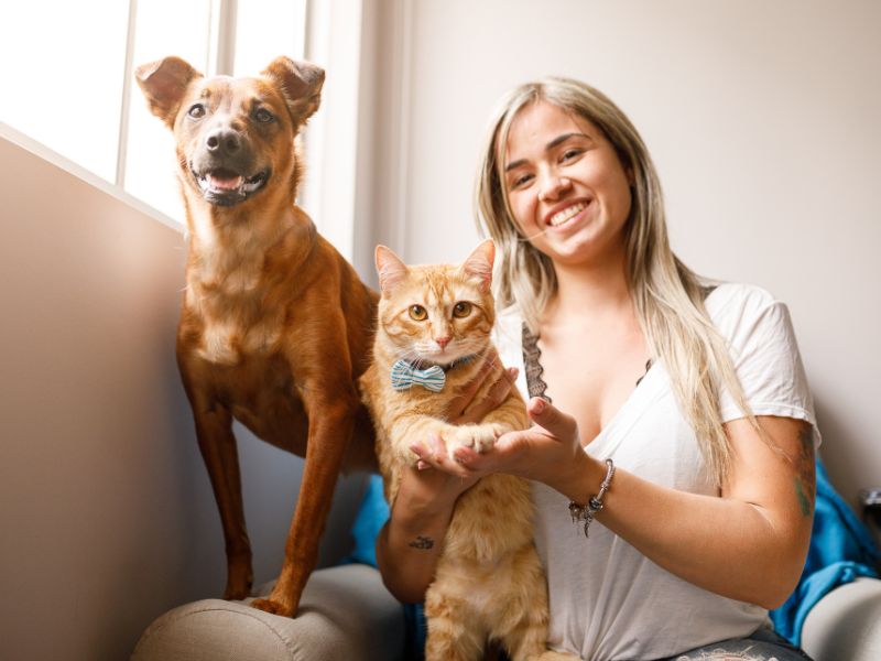 Woman, dog, and cat. Woman, dog, and cat.